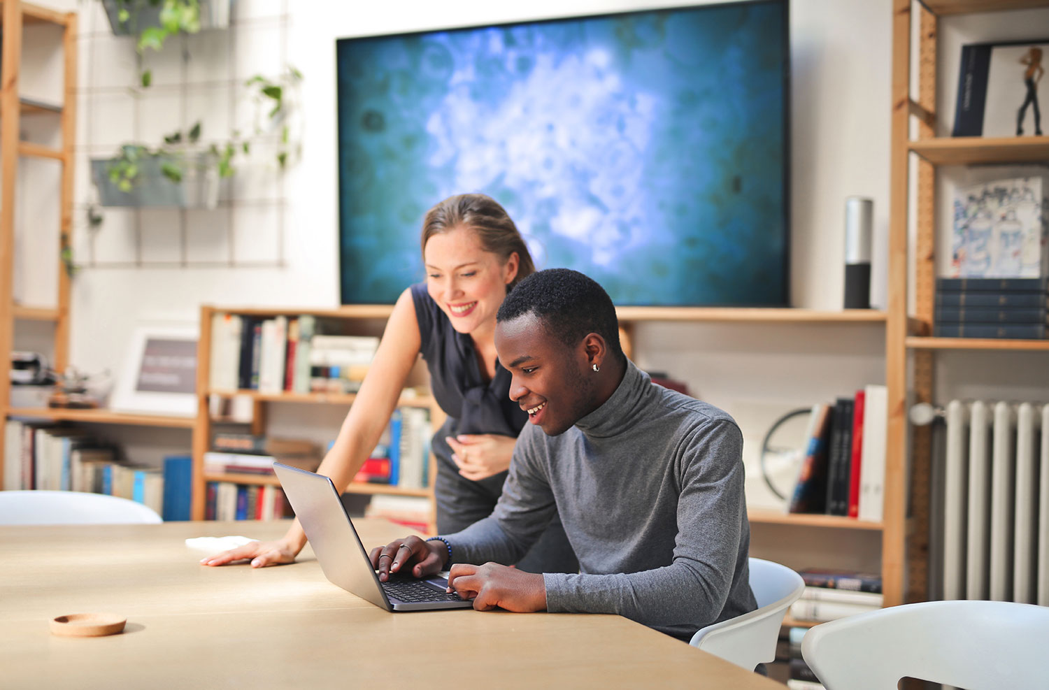 Two people using early childhood education software